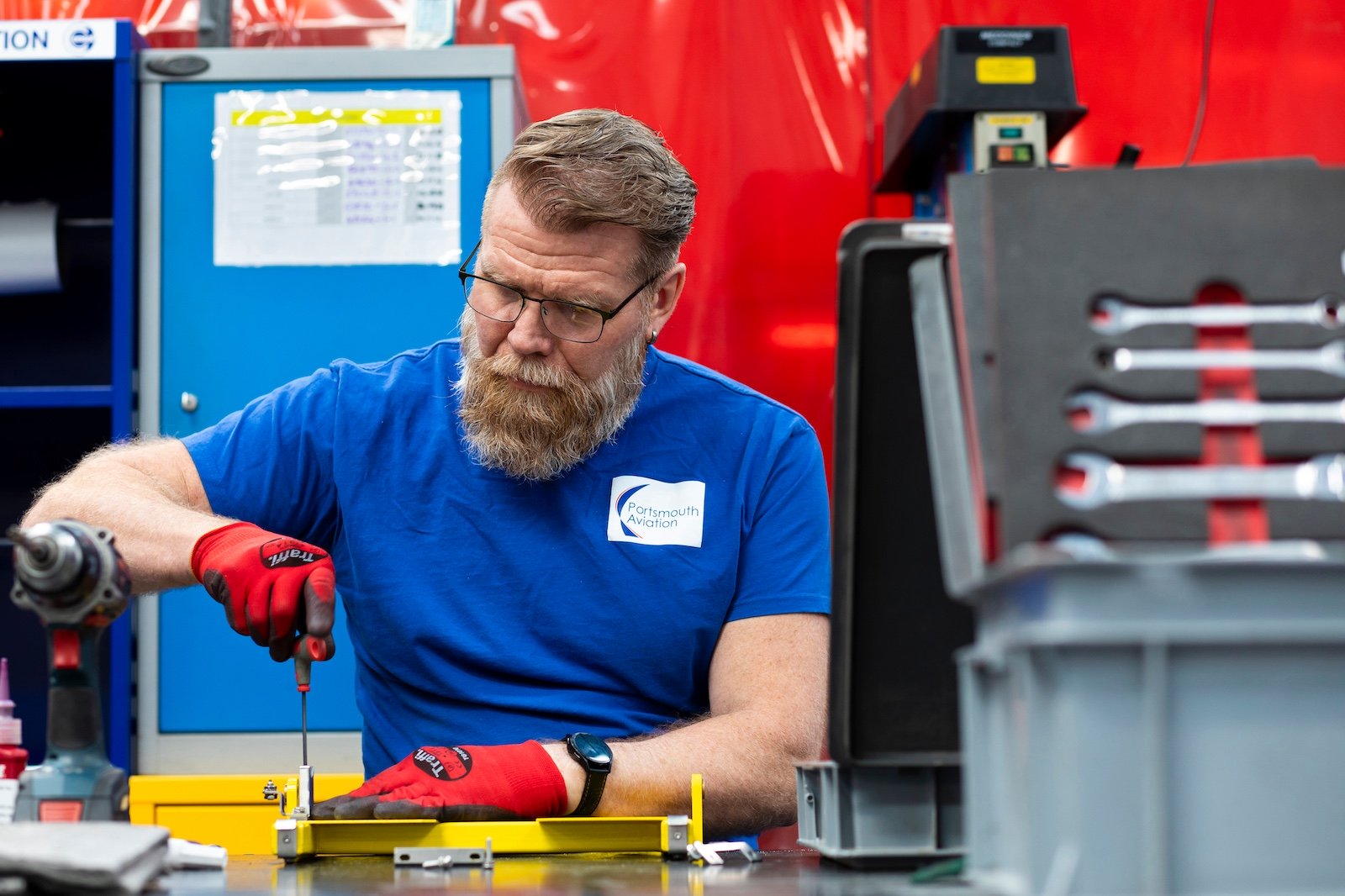 Portsmouth Aviation staff working at workbench
